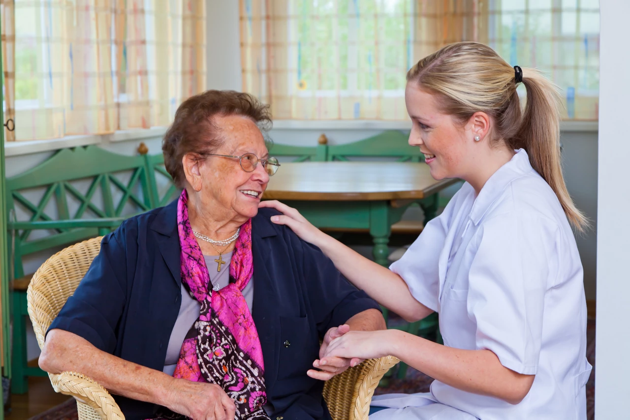 Carer chatting with patient
